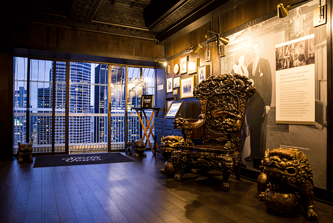 Throne chair and skyline visible through skydeck doors